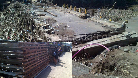 Jembatan Dendengan yang kembali amblas dan material jembatan darurat (foto beritamanado)