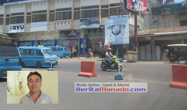 Marka jalan di depan SPBU Paldua (insert: Winston Monangin)