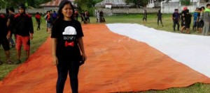 SHPA Kibarkan Bendera Raksasa di Pawai Pembangunan Mitra