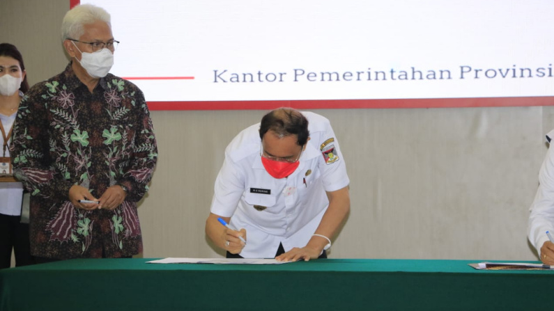 Bupati Royke Roring Tandatangani MoU dan PKS Implementasi Tax Online