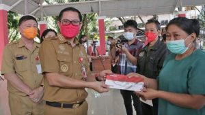 Pemkab Minut Salurkan 7.161 Paket Bapok, Percepat Vaksinasi, Gaungkan Prokes