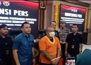 Berbaju Tahanan dengan Tangan Diborgol, MK Tersangka Ujaran Kebencian Minta Maaf ke Warga Sulut