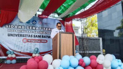 Christian Talumepa membawakan sambutan mewakili Victor Mailangkay di Dies Natalis ke-68 FH Unsrat.